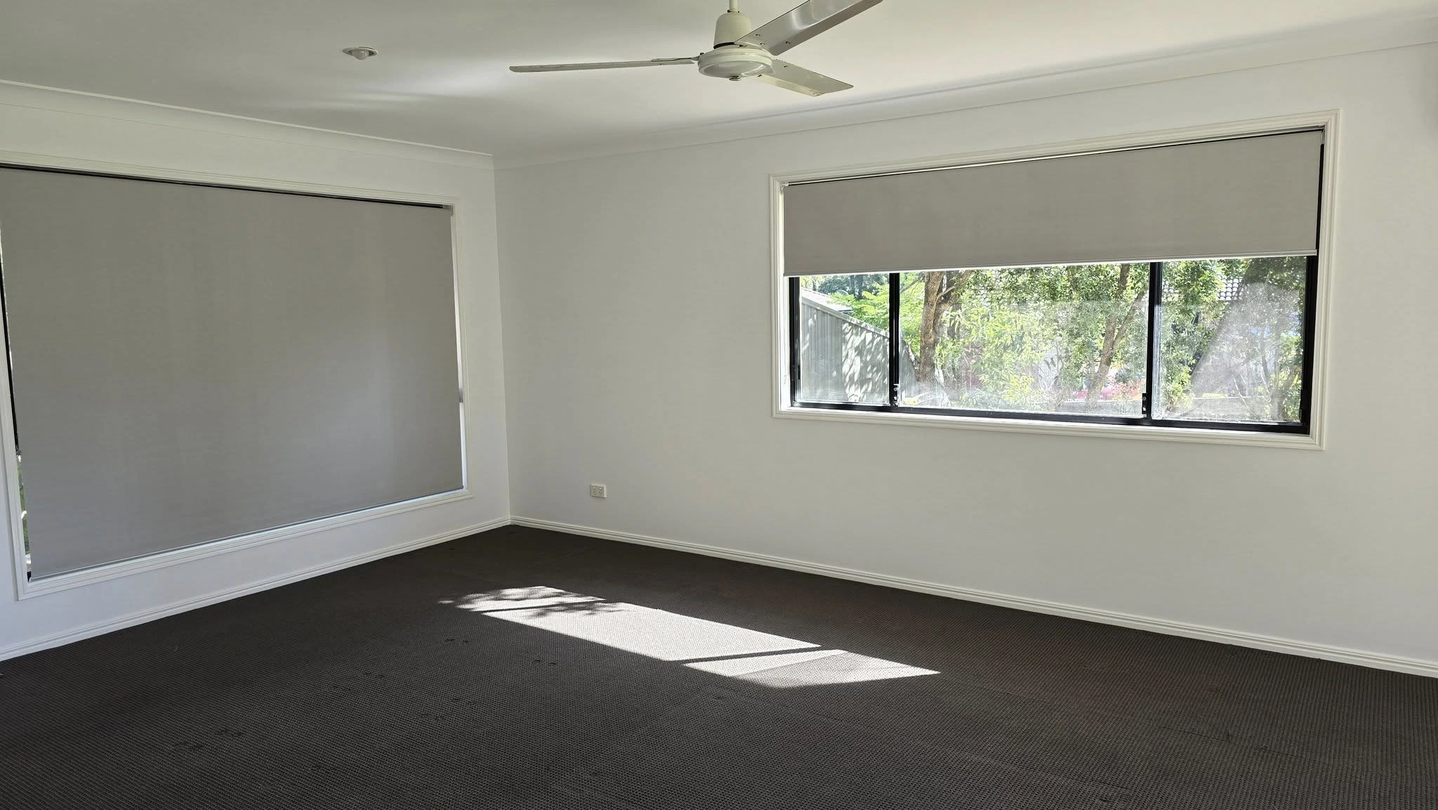 Inside view of roller blinds on the window and door