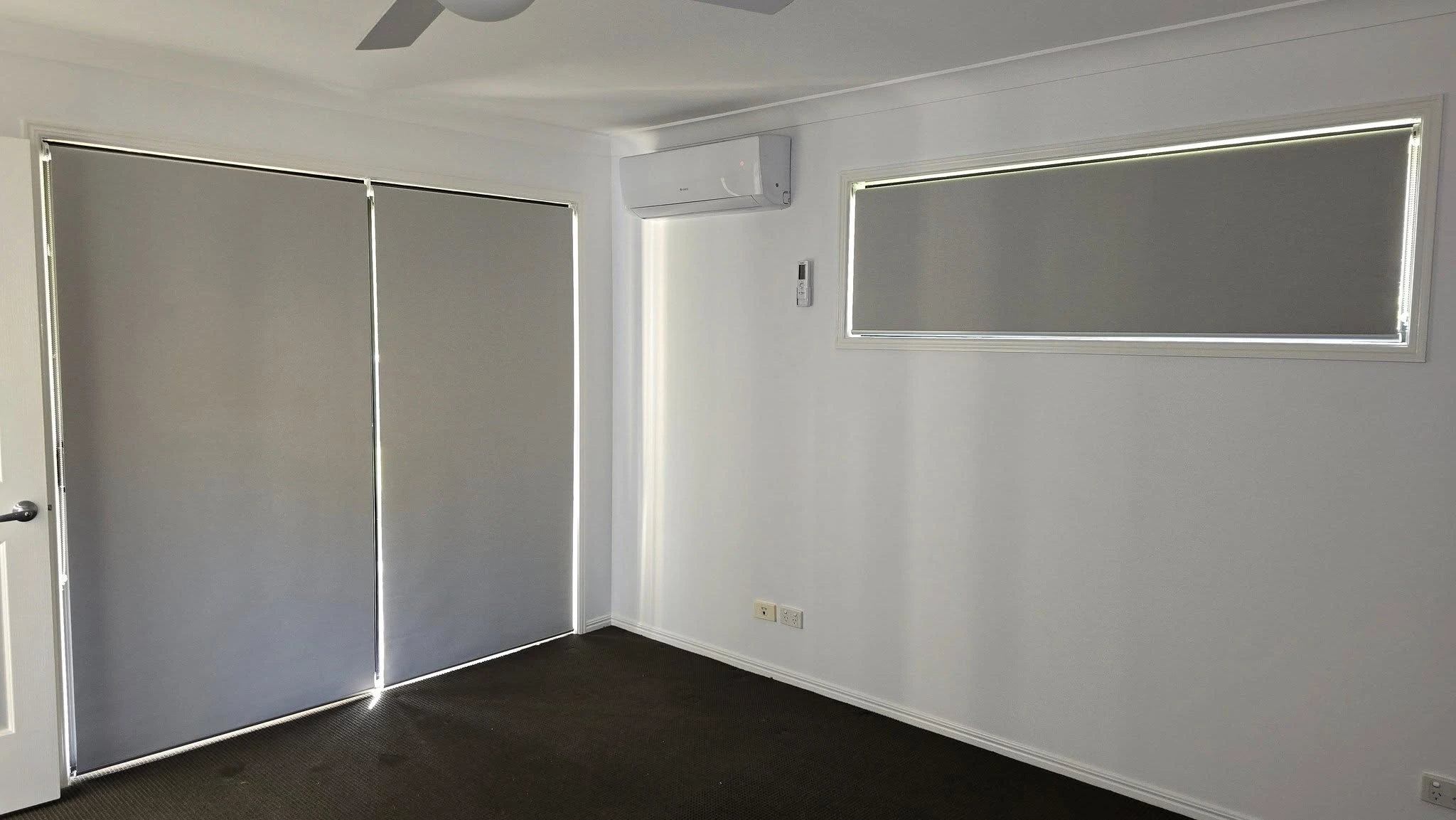 Roller blinds covering the window and door