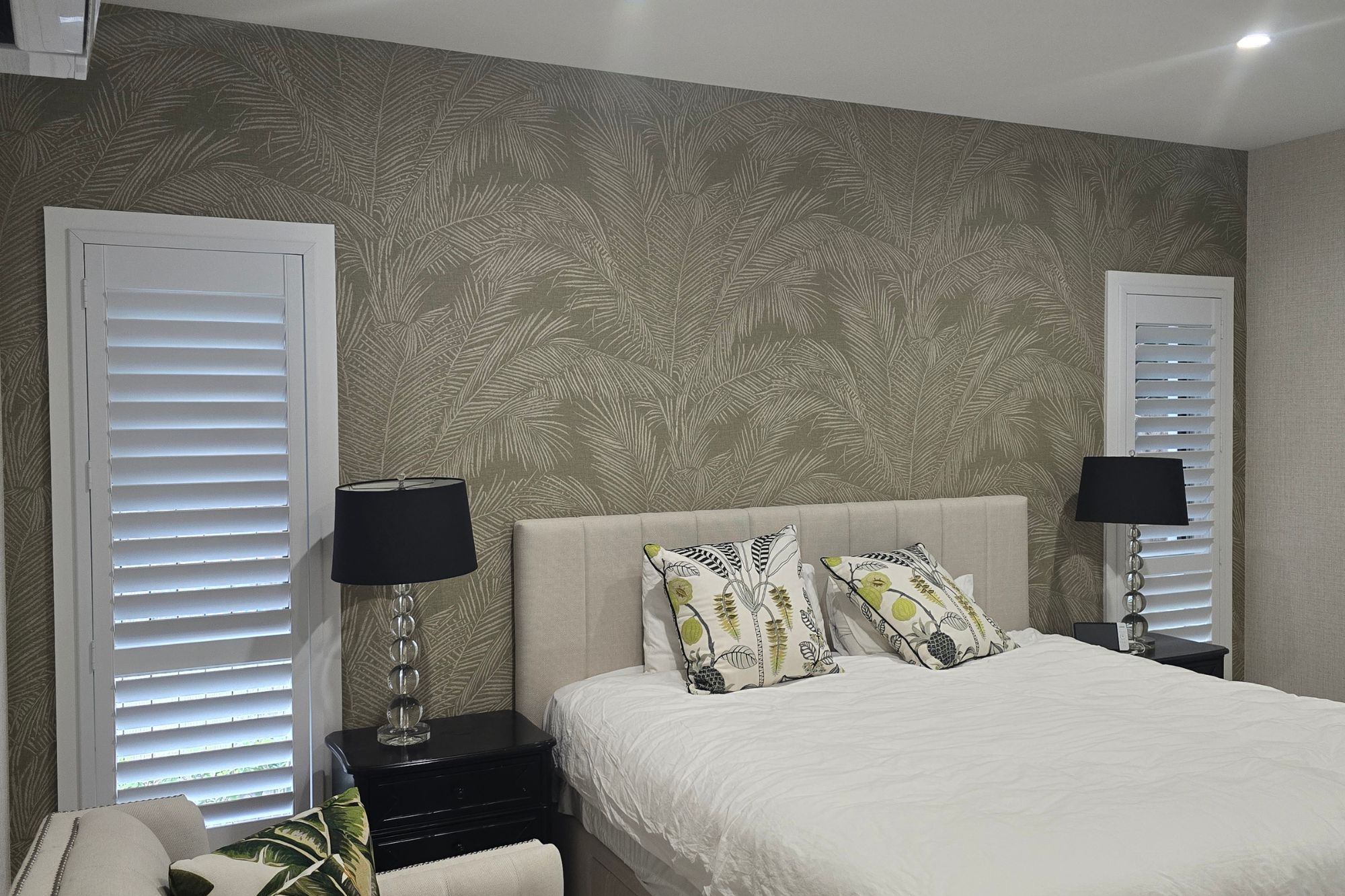 2 plantation shutters on either bedroom window