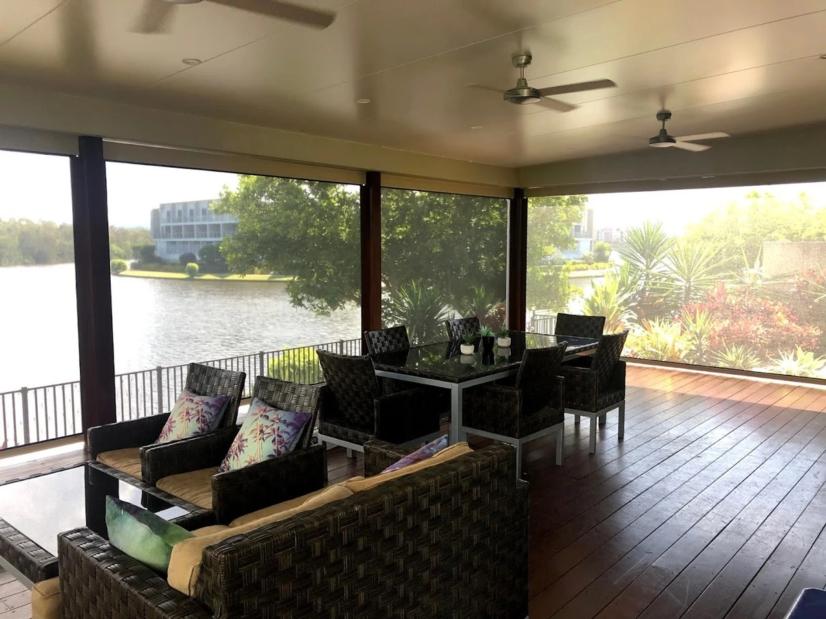 Inside view of outdoor blinds installation with canal views