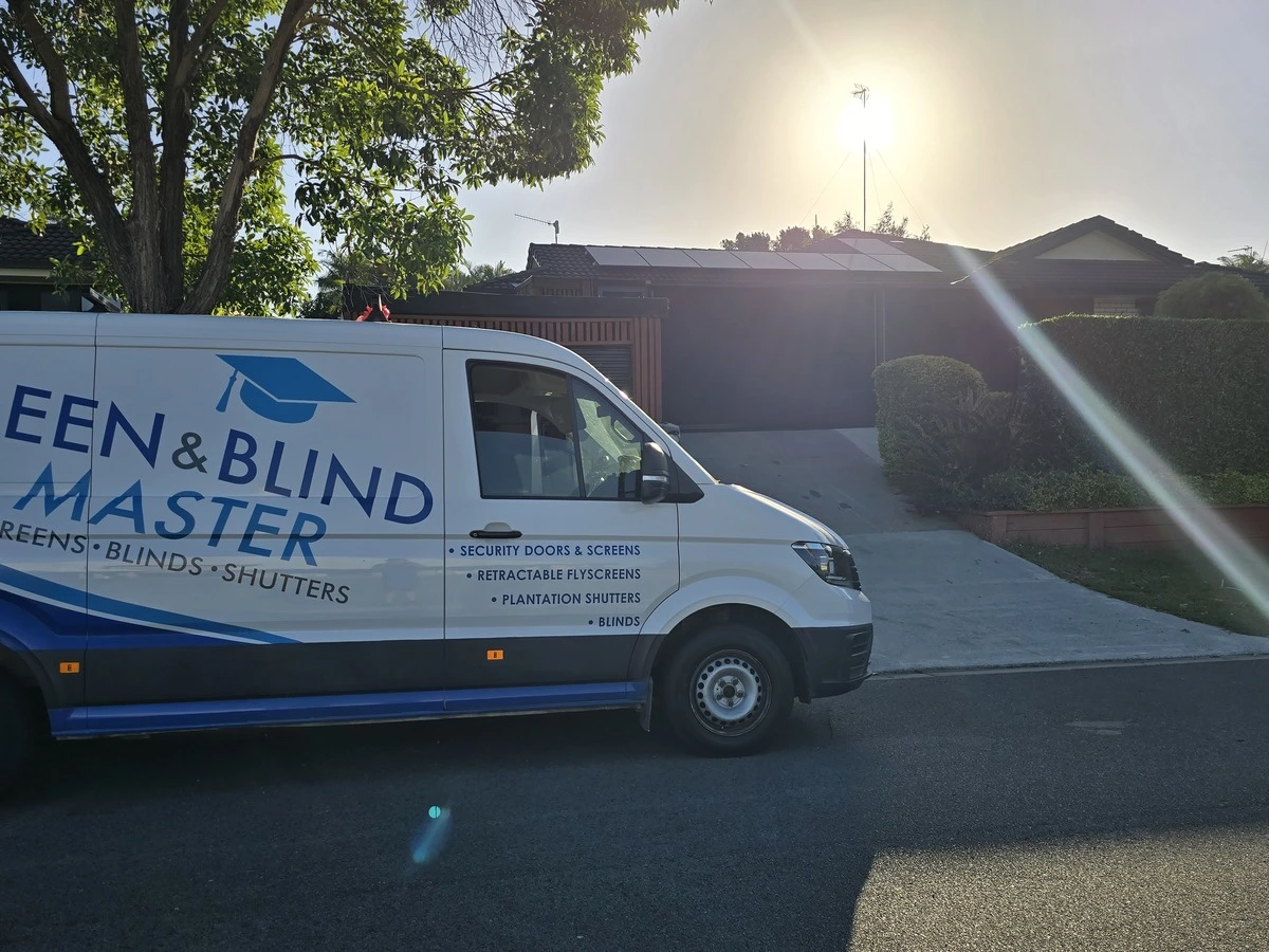 Screen and Blind Master van in front of newly fitted outdoor roller blinds