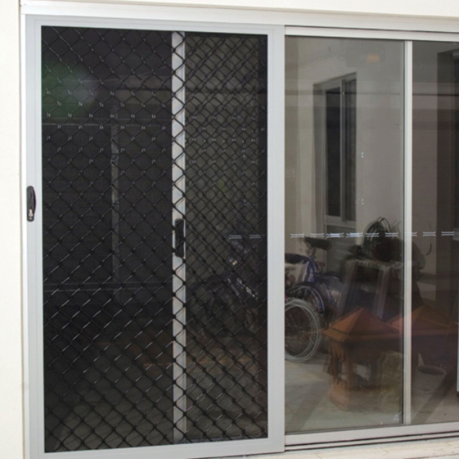 Diamond sliding door to the outdoor living area of house