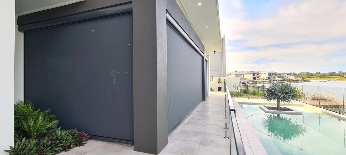 Outdoor blinds installation overlooking pool