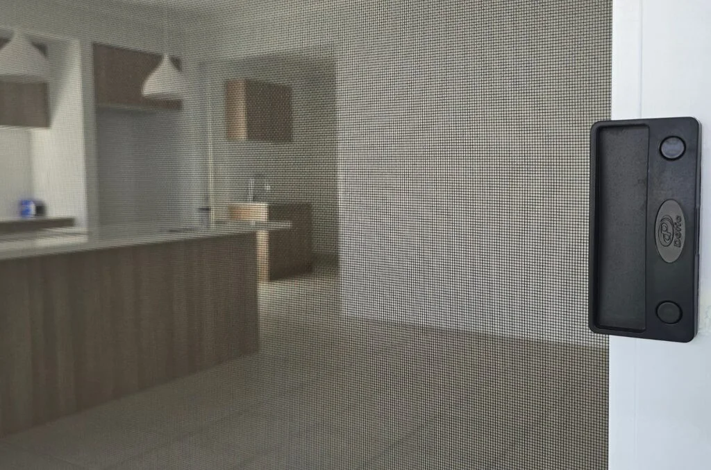 Close up view of a fly screen mesh sliding door
