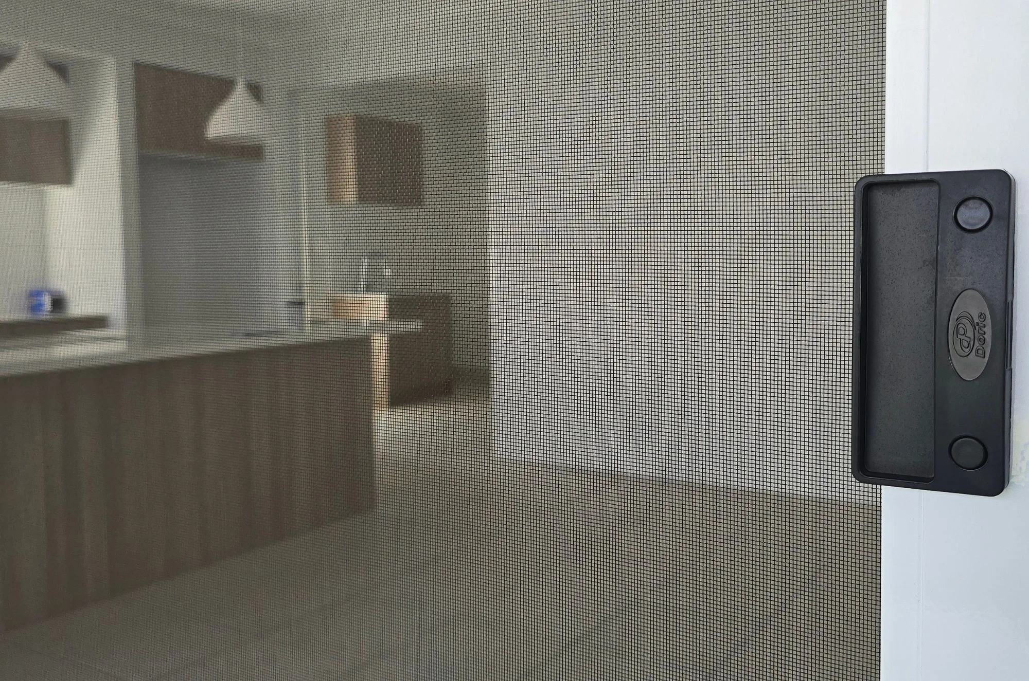 Close up view of a fly screen mesh sliding door